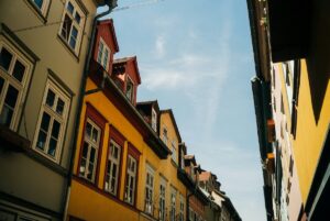 Street view looking up at the colorful buildings of Erfurt