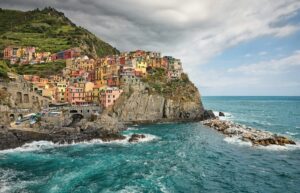 Bright colorful buildings lining cliffside of La Spezia