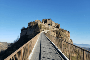 Walkway up to Civita di Bagnoregio with a clear blue sky