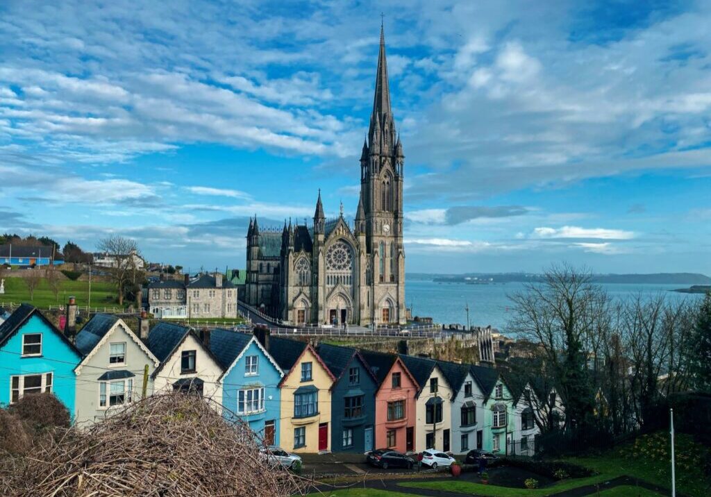 Colorful buildings with tall cathedral in the background