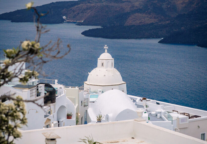 Whitewashed buildings overlooking the bay of Santorini from Fira