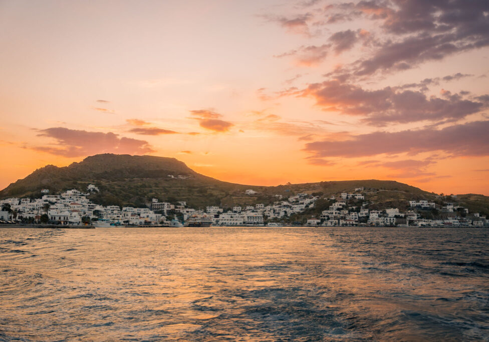 Warm sunset on the Bay of Patmos with the city in the distance